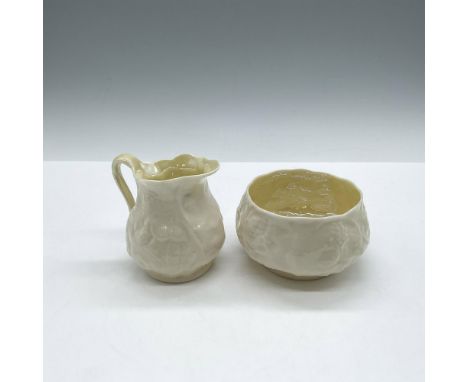 Raised design on creamy porcelain jug (3"H) and sugar bowl (2.25"H). Belleek Ireland black backstamp. Largest piece: 2.25"H x