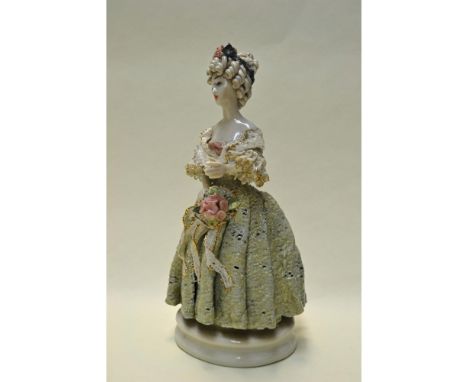 Bisque Glazed Porcelain, hand created, hand painted by Bolesaw Cybis. Early and Rare featuring a Lady in a Mint Green Lace Dr