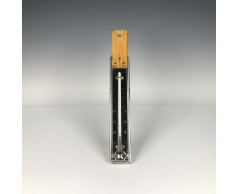 Glass tube housed in a metal frame with a clip on the back and wooden handle. Displays temperature in Fahrenheit, from 30-350