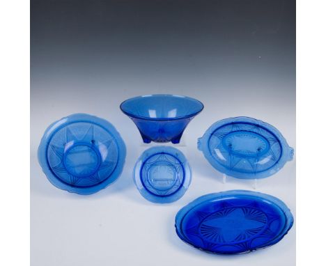 Blue depression glass decorated with lacey floral motifs. Includes 1 three-toed footed bowl, 1 large fruit bowl, 1 small frui