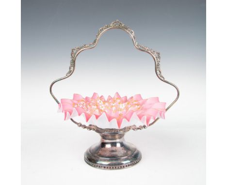 Gorgeous bride's basket pedestal frame with an ornate handle and a dusty pink art glass bowl. The ruffled edge bowl is hand e