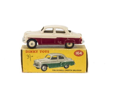 A Dinky Toys 164 Vauxhall Cresta Saloon, maroon lower body, light beige upper body and hubs, in original box, E, box F, red s