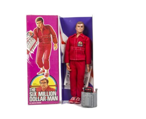 A Denys Fisher Six Million Dollar Man Action Figure, Colonel Steve Austin in red jumpsuit complete with Engine Block and inst