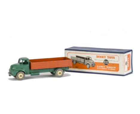 A Dinky Toys 532 Comet Wagon With Hinged Tailboard, dark green cab and chassis, orange back, cream hubs, in original box, E, 