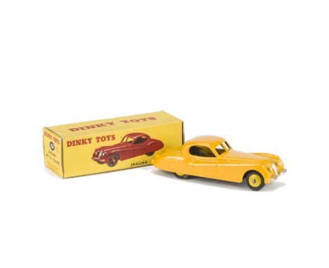 A Dinky Toys 157 Jaguar XK120 Coupe, yellow body, light yellow hubs, in original box, VG, box G 