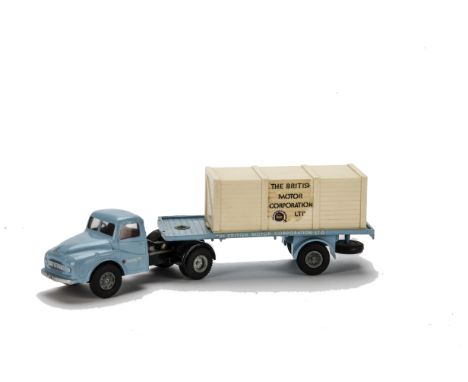 A Tri-ang Spot-On No.106a/0c Austin Flatbed Lorry With Crate, light blue cab and trailer, black chassis, bare metal hubs, emp