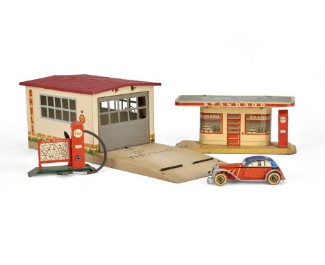 A Kibri Tip Top Tinplate 'Shell' Garage, with electric light fitting, Distler or similar small battery-operated tinplate Petr