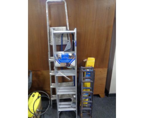 A set of aluminium folding steps together with an aluminium loft ladder, pair of car ramps and a workbench in box.  