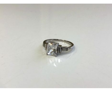 An Art Deco style Sterling silver emerald cut ring, size N.