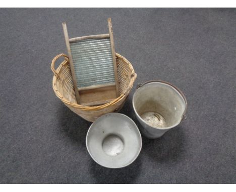 A wicker basket containing galvanised bucket and a small quantity of tools, glass washboard 