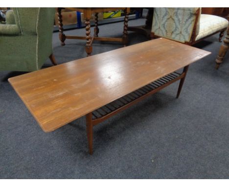 A mid 20th century teak rectangular coffee table with under shelf.   CONDITION REPORT: 160cm long by 58cm deep by 46cm high.