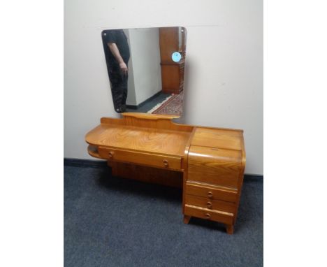 A 20th century Art Deco dressing table, fitted cabinet and four drawers.  