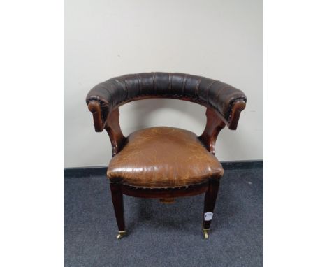 A 19th century mahogany button leather upholstered club armchair.  