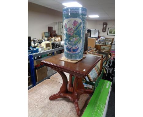 A contemporary pedestal occasional table together with a glazed pottery Chinese style stick pot.   