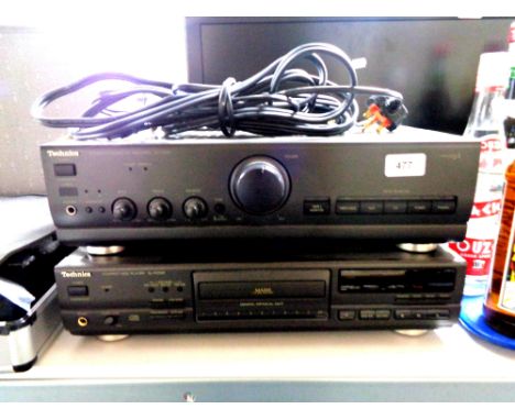 A Technics stereo integrated amplifier, SU-V500 together with a Technics compact disc player SL-PG590 with remotes and speake
