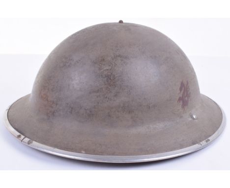 WW2 British Steel Combat Helmet, having painted red dragon to one side of the exterior. Complete with its original 1943 dated