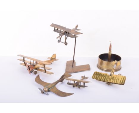 Selection of Brass Trench Art of RAF Interest, consisting of fine model of a bi-plane made from a bullet casing and mounted o