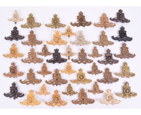 Grouping of Royal Artillery Cap Badges, consisting of officers and other ranks examples. Various periods and variations inclu