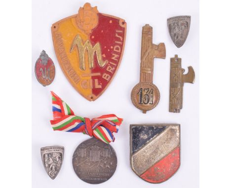 Italian Fascist Badges, consisting of bakelite GIL arm badge, brass 131st Italian infantry cap badge, brass Italian Fasces ba