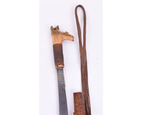 19th Century Borneo Head Hunters Sword Mandau, slightly curved single edge blade swollen towards the tip and profusely inlaid