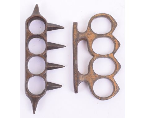 2x WW1 Period Brass Knuckle Dusters, one retaining much of its original field paint finish, the other just brass. Both are un