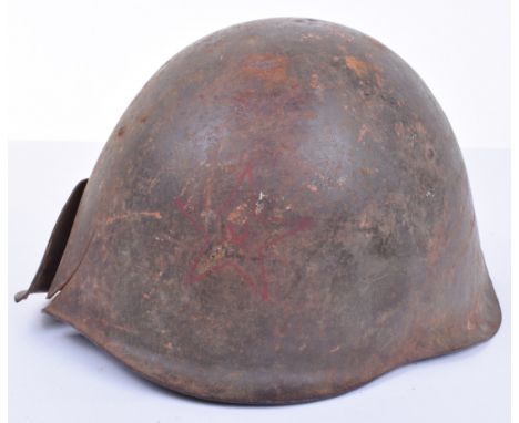 WW2 Soviet Russian Battle Damaged Steel Helmet Shell, being a Sh-39 pattern retaining much of its original paint finish to th