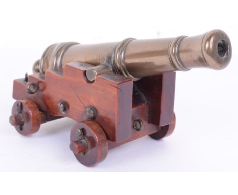 Fine Early Victorian Model of a Ships Cannon, bronze barrel of conventional form with turned reinforces, swollen muzzle, rais