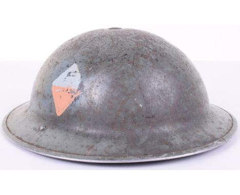 WW2 British Steel Helmet with Painted Regimental Markings, the helmet has a light green paint finish to the exterior of the s