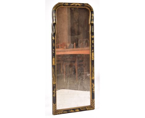 A 19th century black lacquered chinoiserie decorated shaped wall mirror. The mirror with cushions frame surround being black 