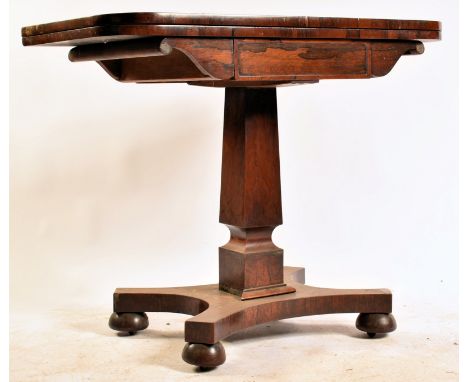 A 19th century William IV rosewood games card table. Raised on bun feet with quatrefoil bae with square column to fold over g