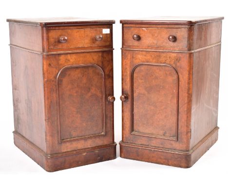 A pair of Victorian 19th century walnut bedside cabinets. Each being raised on plinth bases with short drawers over cupboards