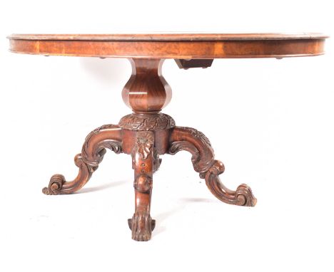 A 19th century Victorian figured walnut oval loo table / breakfast table. The oval top with quarter veneered top supported on