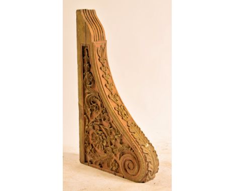 A 19th century carved oak wall bracket / clock bracket support moulded in relief with foliate and floral swags. Measures appr