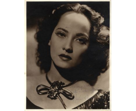 OBERON MERLE: (1911-1979) Anglo-Indian Actress. Vintage signed and inscribed sepia 11 x 14 photograph, an engaging close-up p