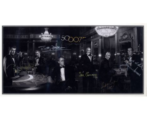 JAMES BOND: A 19 x 9.5 photograph individually signed by the main six actors to have portrayed James Bond, Sean Connery, Geor