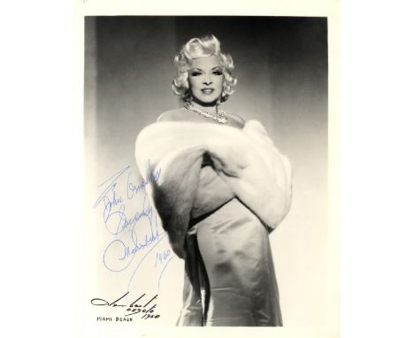 WEST MAE: (1893-1980) American Actress &amp; Sex Symbol. Vintage signed and inscribed 8 x 10 photograph of West standing in a