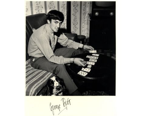 BEST GEORGE: (1946-2005) Northern Ireland &amp; Manchester United Footballer. Signed 8 x 10 photograph of Best seated in a fu