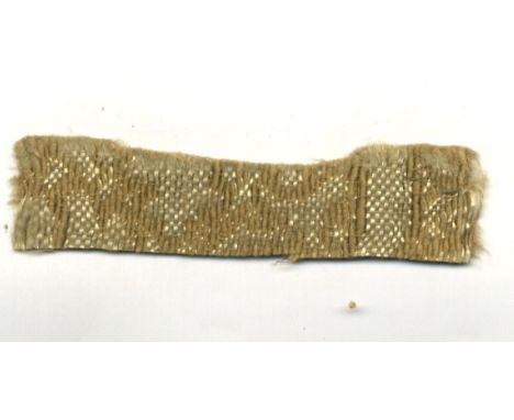 [HITLER ADOLF]: (1889-1945) Fuhrer of the Third Reich 1934-45. A small (2.5 x 0.5) swatch of gold coloured and patterned upho