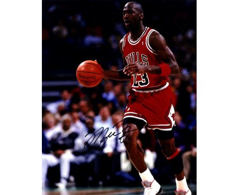 JORDAN MICHAEL: (1963- ) American Basketball Player. Signed colour 8 x 10 photograph of Jordan in a full length action pose w