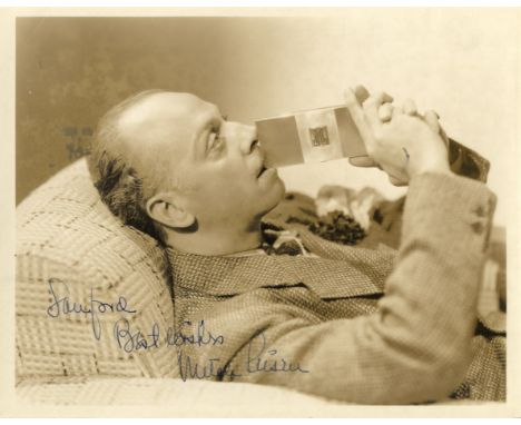LEISEN MITCHELL: (1898-1972) American Film Director. Vintage signed and inscribed sepia 10 x 8 photograph of Leisen seated in
