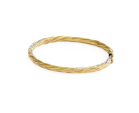 A Hinged Bangle, of intertwined form, inner measurements 5.7cm by 5.0cmStamped '9KT'. Gross weight 10.8 grams.