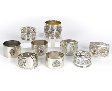 A Collection of Assorted Silver Napkin-Rings, variously decorated, mostly Scottish or with a Scottish theme, including one by