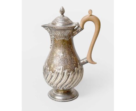 A Victorian Silver Hot-Water Jug, by William Hutton and Sons Ltd., London, 1894, in the George III style, pear-shaped and on 