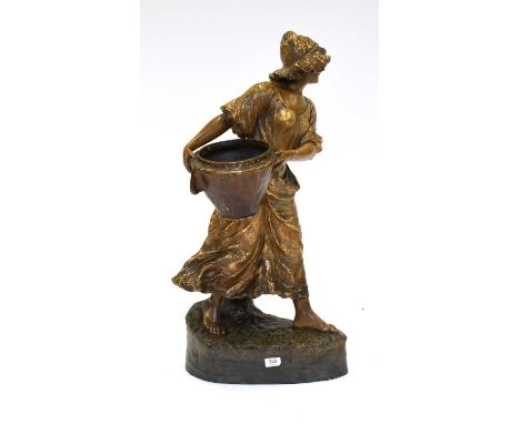 A Painted Terracotta Figure of a Girl Carrying a Basket, after a model by Otto Petri, glazed in brown and gilt, with facsimil