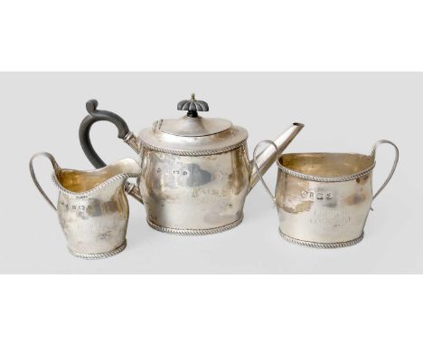 A Three-Piece Edward VII Silver Tea-Service, by Williams (Birmingham) Ltd., Birmingham, 1903, oval and with gadrooned borders
