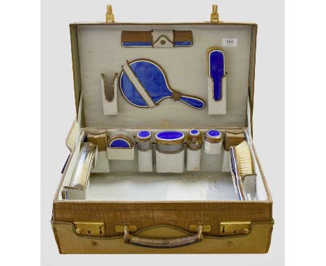 An Edward VII Copper and Enamel Dressing-Table Service, Retailed by Finnigans, London and Manchester, each piece enamelled in
