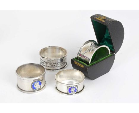 Four Various Silver or Silver and Enamel Napkin-Rings, by William Hair Haseler, Birmingham, one 1906, stamped with a pheasant