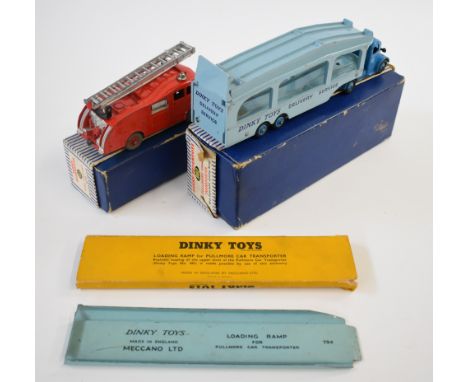 Two Dinky Toys diecast model trucks comprising Fire Engine with extending ladder 955 and Pullmore Car Transporter with detach