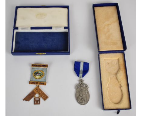 Two Masonic jewels for Finsbury Park Lodge no 1288 comprising 9ct gold and enamel jewel and a hallmarked silver example, both