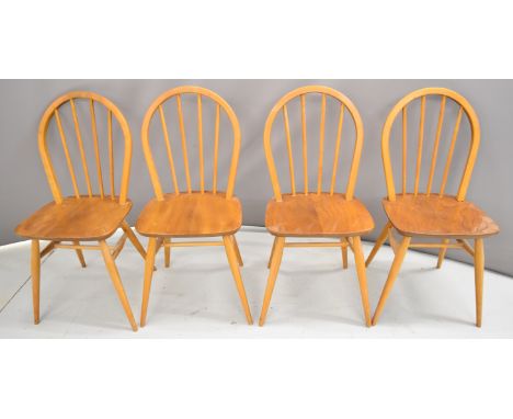 Four Ercol light elm dining chairs
